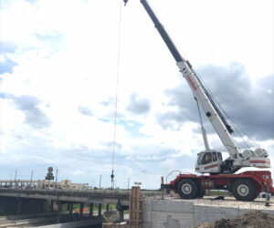 Crew pouring the concrete Rip rap slab for the HWY 185/59 turn round bridge section.