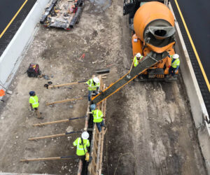 Crew pouring and concrete center median rail at HWY 59/185 Victoria job site.